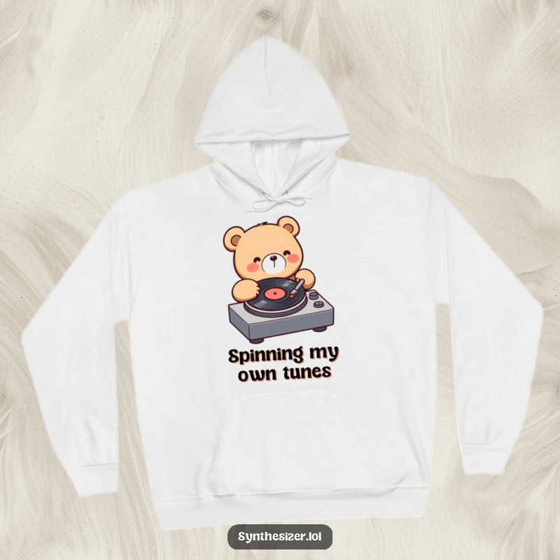 Funny Bear DJ Hoodie: A happy kawaii bear is engrossed in spinning a vinyl record on a turntable, radiating musical excitement.