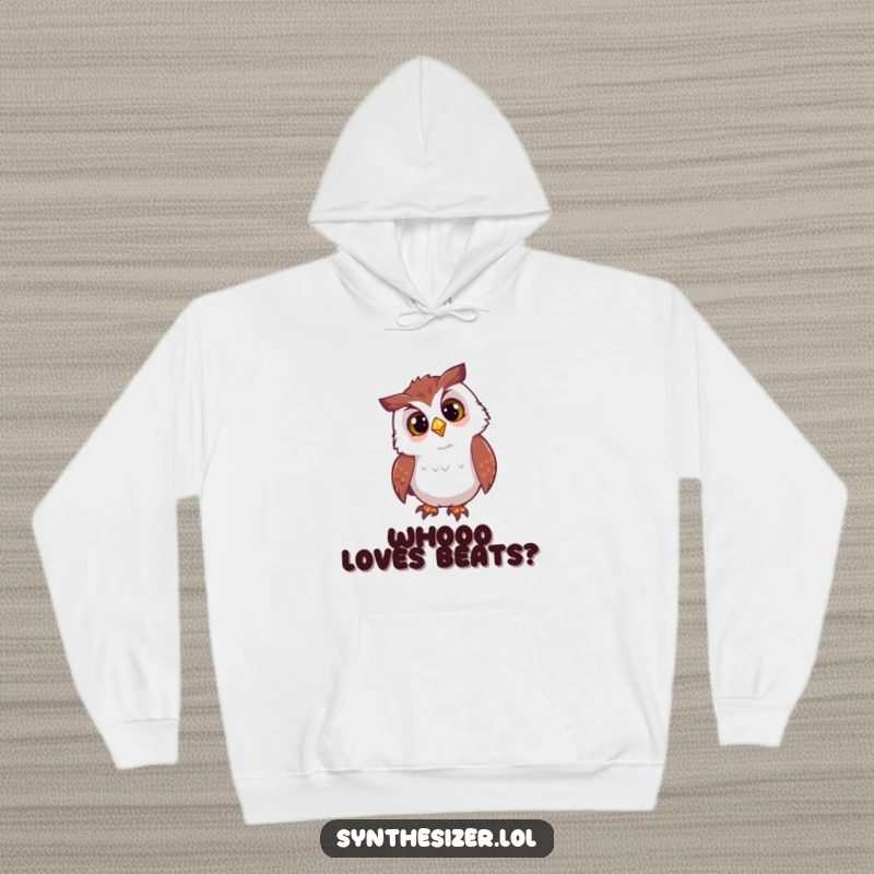 Funny owl hoodie with a curious head tilt, looking at a flashing DJ light, offering cozy enchantment and humorous night vibes.